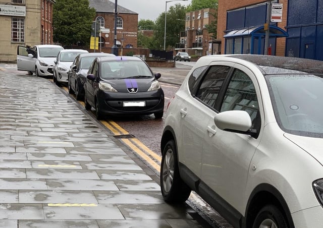 Cars parked on yellow lines in Windsor Street, Melton, on Friday evening EMN-210621-153009001