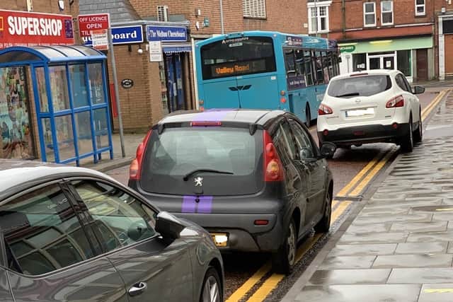 Cars parked on yellow lines in Windsor Street, Melton, on Friday evening EMN-210621-153019001