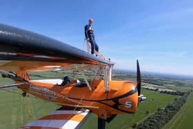 Melton Rotarian Mike Hind-Woodward pictured during his brave charity wing walk

PHOTO by Aerosuperbatics EMN-210628-123832001