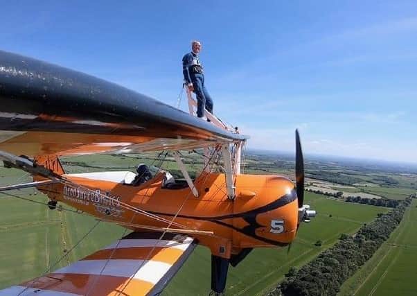 Melton Rotarian Mike Hind-Woodward pictured during his brave charity wing walkPHOTO by Aerosuperbatics EMN-210628-123832001