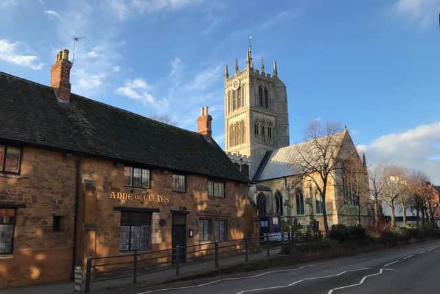 The Anne of Cleves pub and St Mary's Church on Burton Street, in Melton EMN-210707-144514001