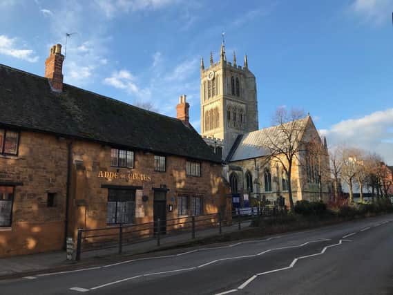 The Anne of Cleves pub and St Mary's Church on Burton Street, in Melton EMN-210707-144514001