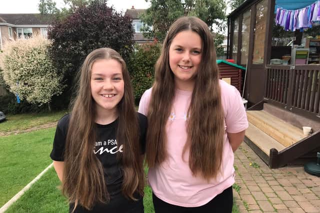 Melton school friends Millie and Lucie who are having their long hair cut in aid of the Little Princess Trust EMN-210107-181454001