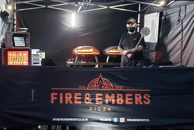 Louis Morgan making pizzas for the Fire and Embers pizza business at Melton Livestock Market EMN-210607-084237001