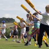 Youngsters enjoy a session run by the Belvoir Cricket and Countryside Trust at Knipton - the scheme is being run again in August EMN-210807-172614001