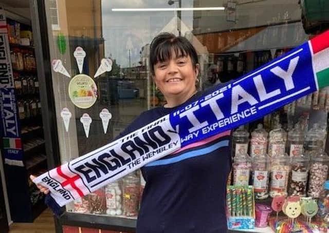 The special Euro 2020 scarf being sold at Melton shop, How Sweet, ahead of Sunday's England v Italy final EMN-210907-145353001