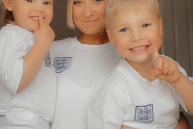 Paige Harrison with son Coby (4) and daughter Sienna (2) at their Melton family home proudly wearing their England shirts for the Euros final EMN-211207-095937001