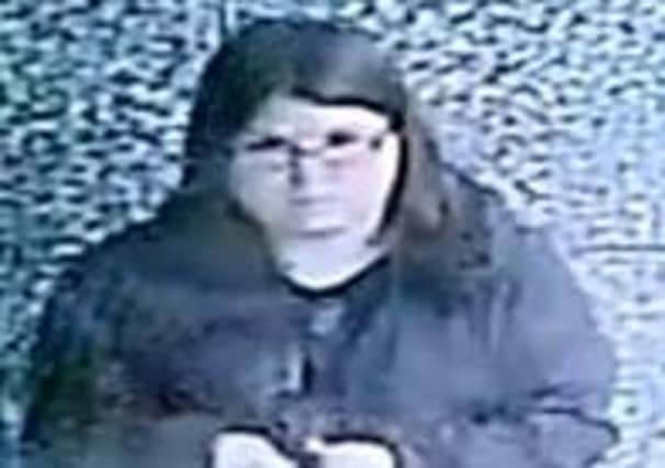 A CCTV image of a woman Leicestershire Police want to speak to in connection with the theft of cash and a bank card from an 85-year-old Asfordby woman's home EMN-210713-155034001