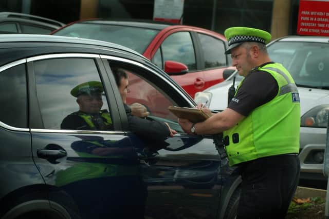 Police pull over a driver during a previous Fatal4 operation in Melton EMN-210723-174258001