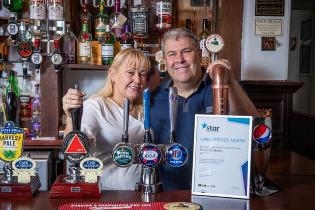 Licensees of The Half Moon pub in Melton Mowbray, Martin Davis and Sandra Shaw, who are celebrating 20 years of running the pub EMN-210508-145415001