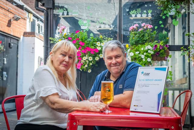 Licensees of The Half Moon pub in Melton Mowbray, Martin Davis and Sandra Shaw, who are celebrating 20 years of running the pub EMN-210508-145428001