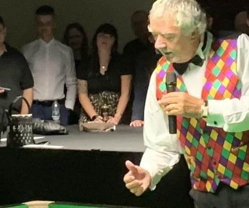 John Virgo pictured during his warm-up trick shot display at the exhibition night at Jackson's in Melton EMN-210908-091859001