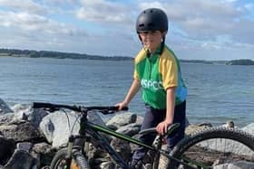 11-year-old Louie Hill pictured during his fundraising cycle around Rutland Water in aid of the NSPCC EMN-210817-174134001