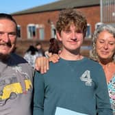 A student gets his GCSE results this morning at Long Field Academy EMN-211208-112428001