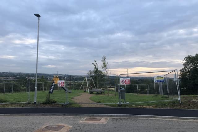 Unfinished work at Bellway's Steeple Chase housing development at Frisby on the Wreake, leaving the children's play area still fenced off EMN-210823-175939001