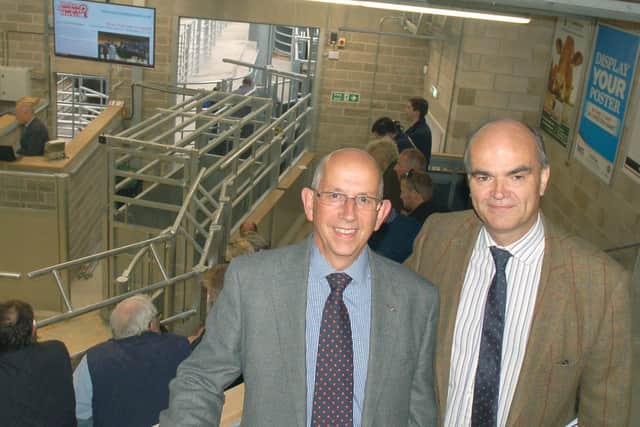 Steve Jeal (Melton NFU Mutual senior group secretary) and (right) Simon Fisher (NFU county advisor for Leicestershire, Northamptonshire and Rutland) prepare to watch the first auction in the new livestock building at Melton Cattle Market back in 2017 EMN-210824-121518001