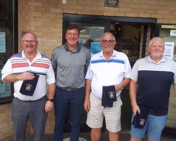 Grant Brown (second left) with the winning team, from left, Jeff Purdy, Roger Smith and Ian McParland. Not pictured: Eddie Malloy.
