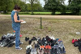 Helen Cliff with donated footwear for the refugees at Scalford hotel EMN-210914-171924001