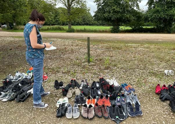 Helen Cliff with donated footwear for the refugees at Scalford hotel EMN-210914-171924001