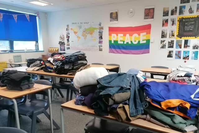 Some of the clothing collected by pupils and staff at Long Field Spencer Academy for asylum seekers who are staying at a hotel near Melton while their claims are processed EMN-210914-172258001