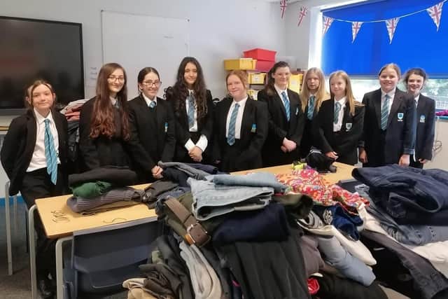 Some of the clothing collected by pupils and staff at Long Field Spencer Academy for asylum seekers who are staying at a hotel near Melton while their claims are processed EMN-210914-172248001