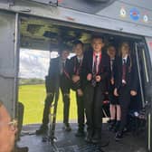 Students enjoy a visit to Melton's John Ferneley College by former pupil, Flt Lt Clark, and his crew colleagues from Puma Force, RAF Benson EMN-210930-132106001
