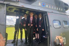 Students enjoy a visit to Melton's John Ferneley College by former pupil, Flt Lt Clark, and his crew colleagues from Puma Force, RAF Benson EMN-210930-132106001