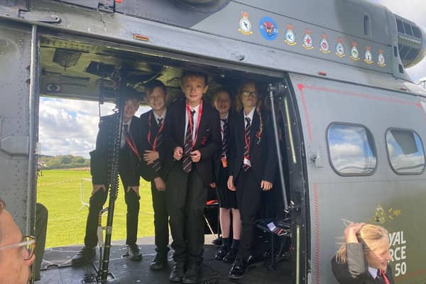 Students enjoy a visit to Melton's John Ferneley College by former pupil, Flt Lt Clark, and his crew colleagues from Puma Force, RAF Benson EMN-210930-132106001