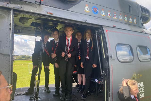 Students enjoy a visit to Melton's John Ferneley College by former pupil, Flt Lt Clark, and his crew colleagues from Puma Force, RAF Benson EMN-210930-132106001