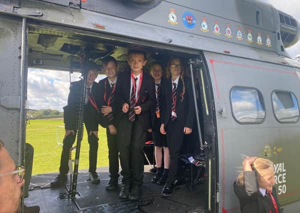 Students enjoy a visit to Melton's John Ferneley College by former pupil, Flt Lt Clark, and his crew colleagues from Puma Force, RAF Benson EMN-210930-132106001