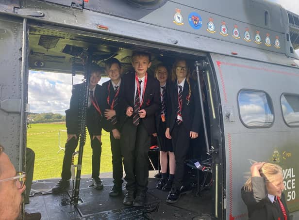 Students enjoy a visit to Melton's John Ferneley College by former pupil, Flt Lt Clark, and his crew colleagues from Puma Force, RAF Benson EMN-210930-132106001