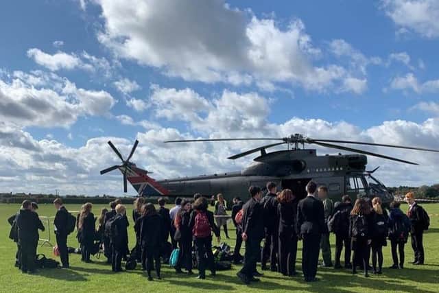 Students enjoy a visit to Melton's John Ferneley College by former pupil, Flt Lt Clark, and his crew colleagues from Puma Force, RAF Benson EMN-210930-132056001