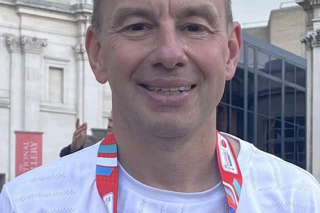 Melton runner Andrew Wrath with his medal after completing Sunday's London Marathon EMN-210410-111404001