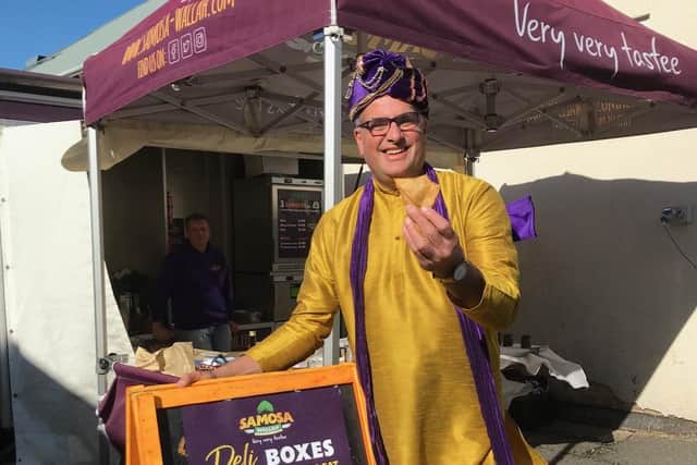 The Samosa Wallah on his stand at the East Midlands Food Festival at Melton Livestock Market on Sunday EMN-210410-155110001