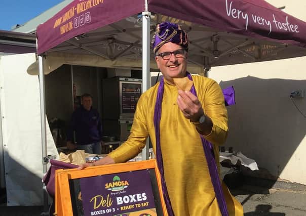 The Samosa Wallah on his stand at the East Midlands Food Festival at Melton Livestock Market on Sunday EMN-210410-155110001