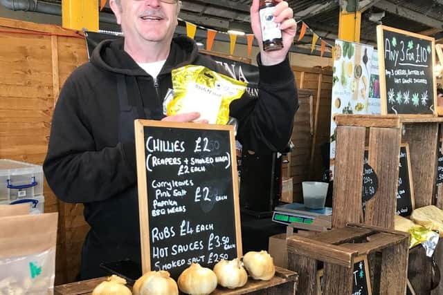 Graham Oaks mans the Feast and the Furious stand at the East Midlands Food Festival at Melton Livestock Market on Sunday EMN-210410-155150001