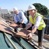 Chris Jones (emh) and Eleanor Deeley (Deeley Group) pictured at the 'topping out' ceremony at The Willows development in Asfordby EMN-210710-155500001