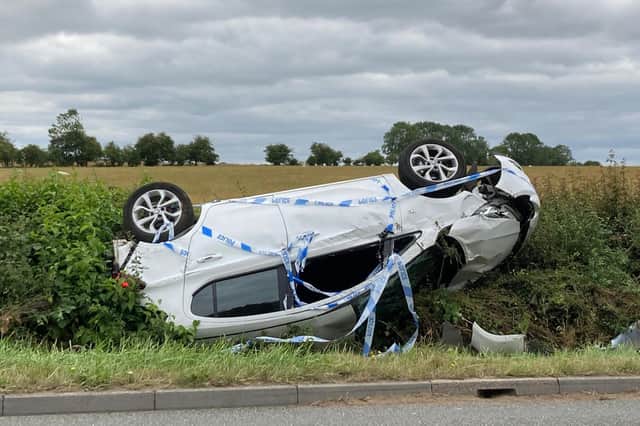 A car on its roof following a two-car collision on the Burton Road just outside Melton on Sunday afternoon