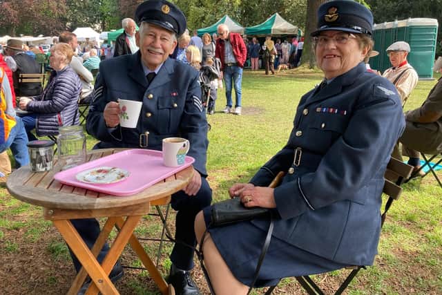 Two attendees in RAF uniform from the era enjoy a cup of coffee at last year's 1940s Melton Mowbray event