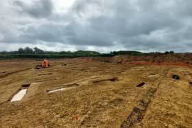 Archaeologists examine remains of Roman planting beds in the farmstead unearthed during work to build Melton's NEMMDR
