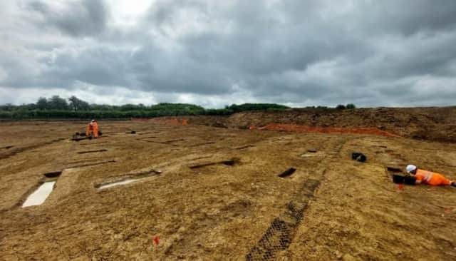 Archaeologists examine remains of Roman planting beds in the farmstead unearthed during work to build Melton's NEMMDR