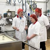 Cropwell Bishop Creamery director, Robin Skailes (left) chats with farming minister, Sir Mark Spencer, and Rushcliffe MP, Ruth Edwards