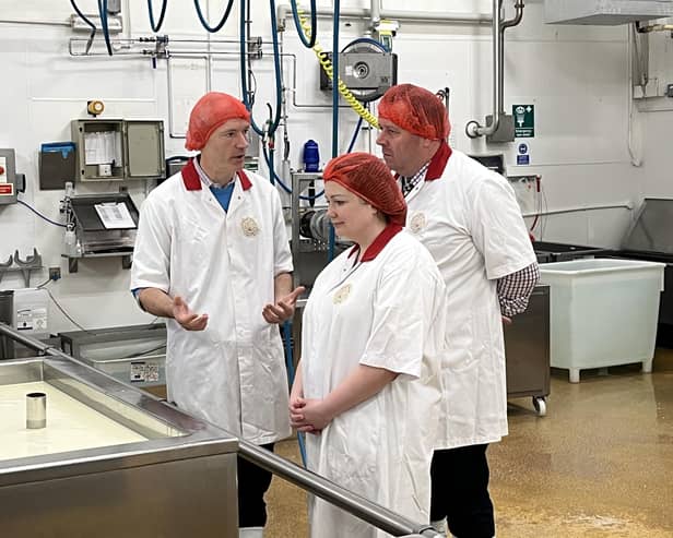 Cropwell Bishop Creamery director, Robin Skailes (left) chats with farming minister, Sir Mark Spencer, and Rushcliffe MP, Ruth Edwards