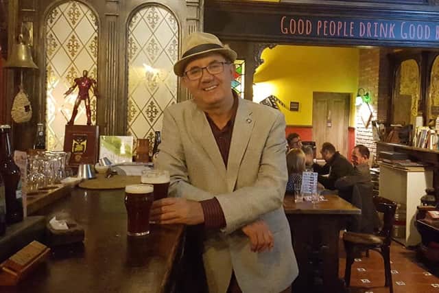 Gary Cross enjoying a pint of real ale