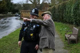PCC Rupert Matthews discussing crime prevention in a Leicestershire village
