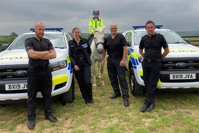 Pictured at the rural crime event at Somerby, from left, Leicestershire Police officers Rob Cross, Claire Hughes, Chris Vickers and Paul Archer, with police volunteer Lisa Emary in the saddle on Seamus