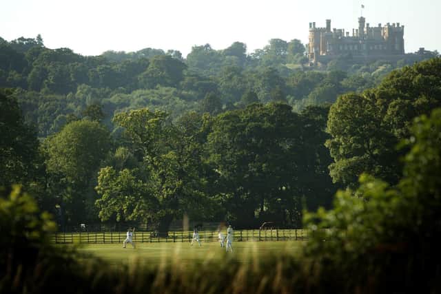 A game of cricket being played at Belvoir Cricket Club, at the foot of Belvoir Castle, at Knipton (Photo by Laurence Griffiths/Getty Images)