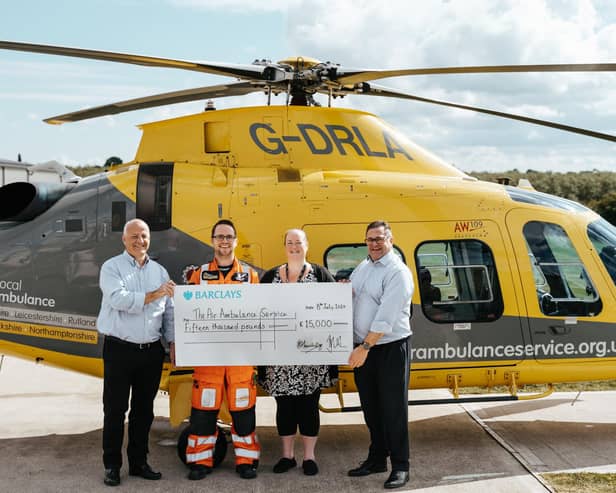 The Grace Trust present a cheque for £15,000 to the local air ambulance