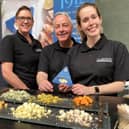 The Clawson dairy stand at the 2023 Artisan Cheese Fair at Melton Mowbray offers different cheeses for the public to sample
