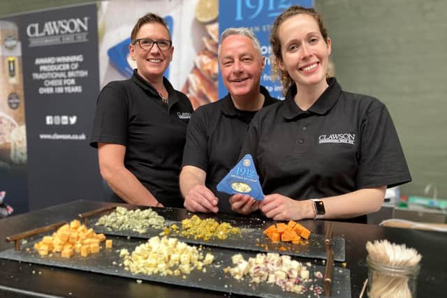 The Clawson dairy stand at the 2023 Artisan Cheese Fair at Melton Mowbray offers different cheeses for the public to sample